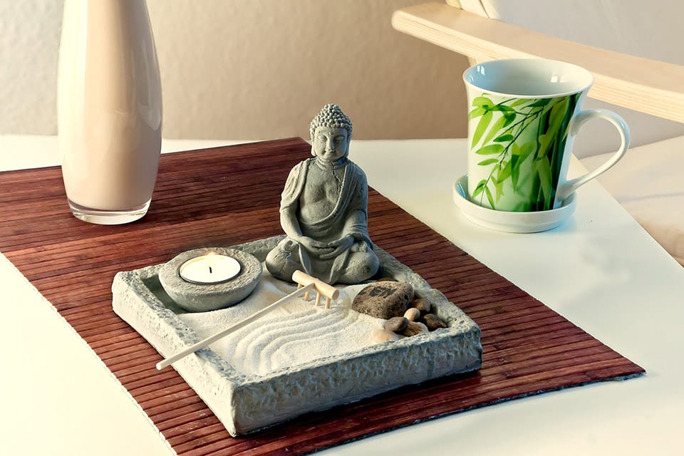 Feng Shui arrangement with a mini Buddha garden on a table