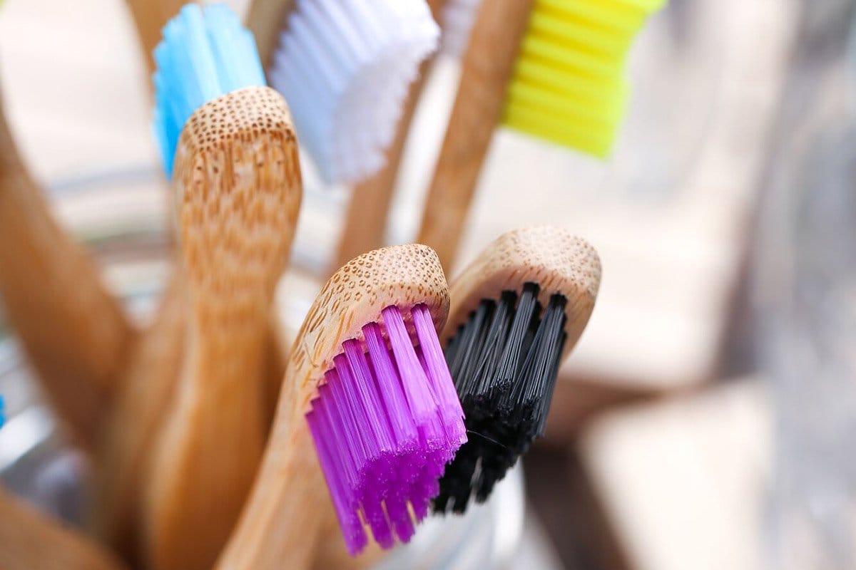 Many bamboo toothbrushes with different bristle colors