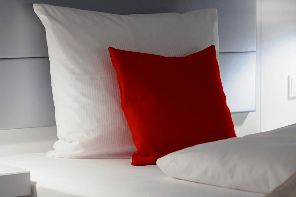 Red and white bed pillow