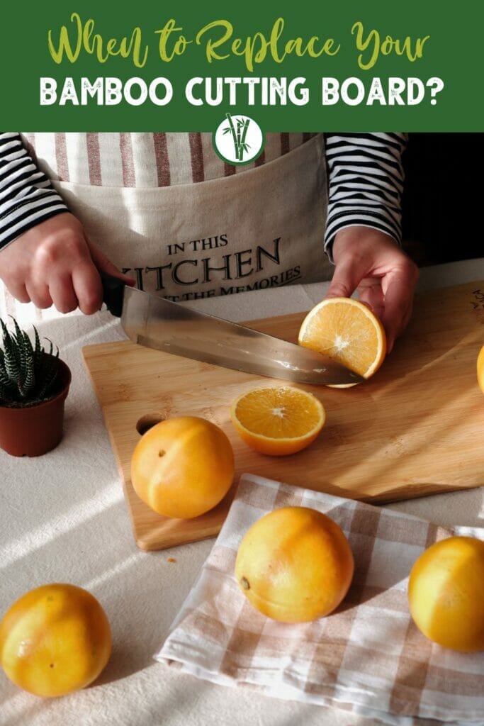 a person chopping an orange using a bamboo cutting board with the text When to replace your bamboo cutting board?