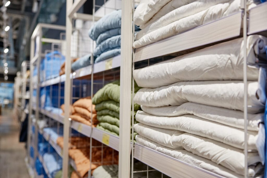 Stack of bamboo bed sheets displayed on a shelf