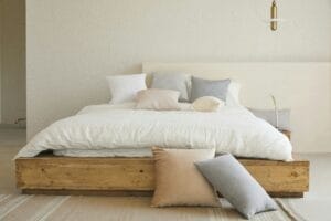 Minimalist bedroom with cushion pillows and bamboo bed sheets