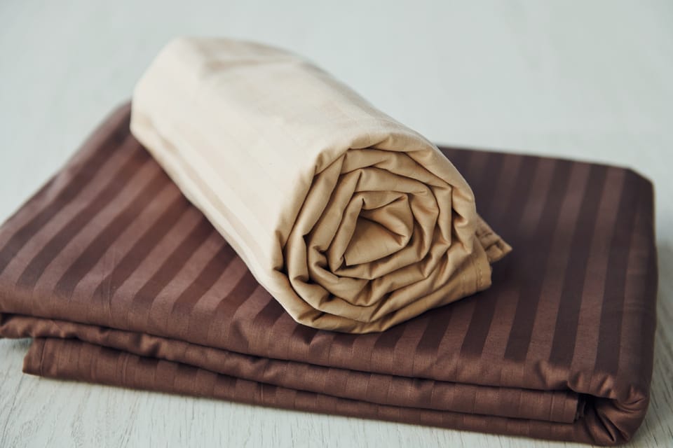 Close up view of rolled viscose bamboo bed sheets
